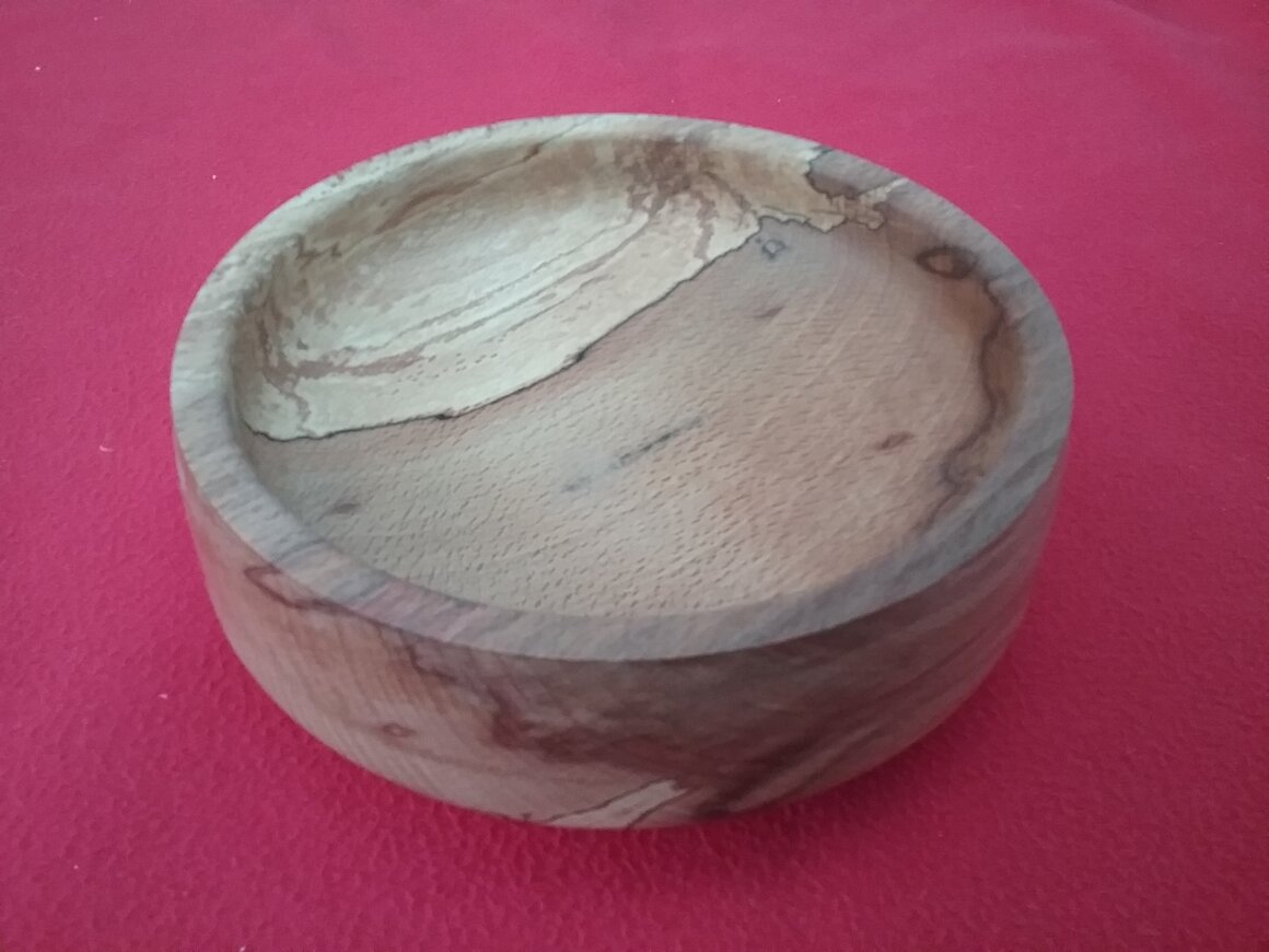 Shallow elm fruit bowl with fruit inside