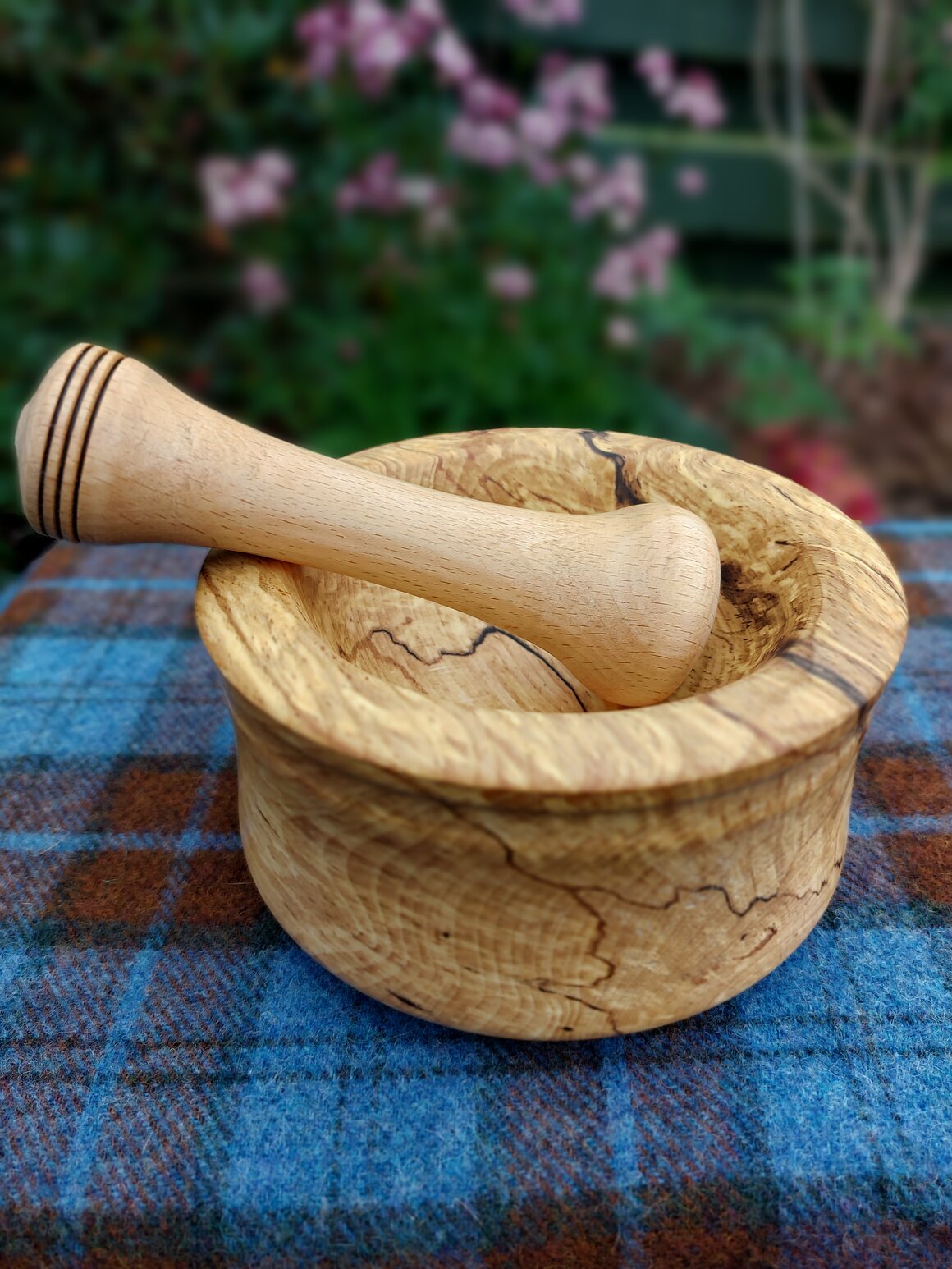 Handmade wooden kitchenware including rolling pin and boards