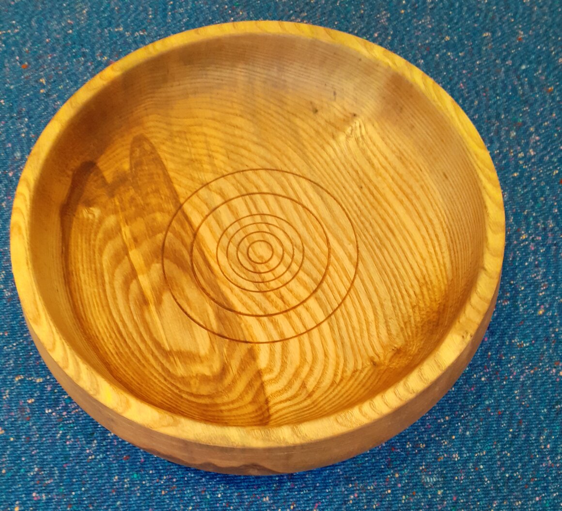 Selection of hand-turned wooden bowls and platters on a table