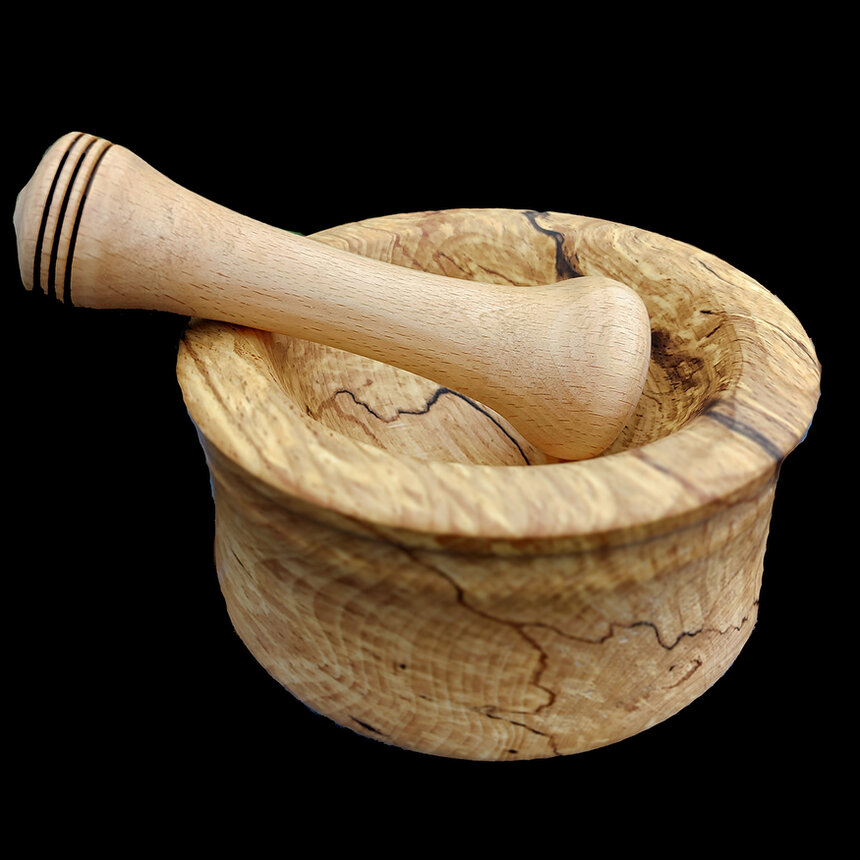 Handmade wooden kitchenware on a wooden worktop