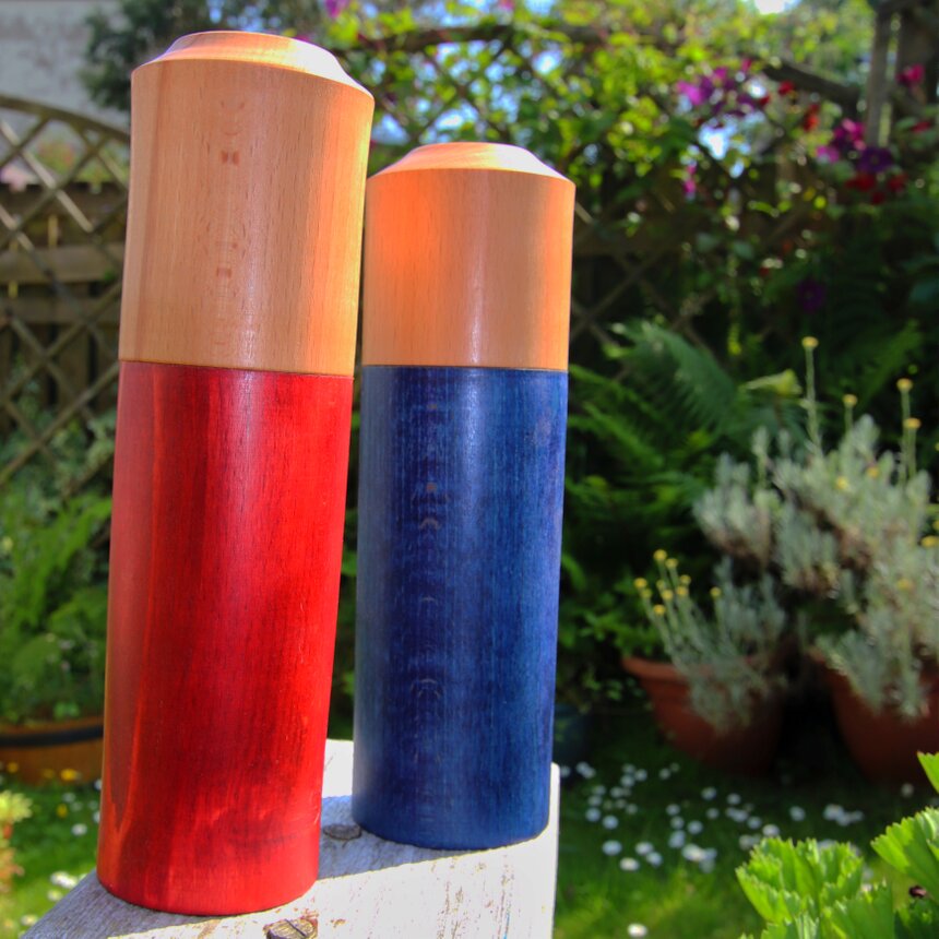 Wooden pepper and salt mills on a dining table